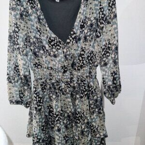 never worn. still has tags. has a little button to show less chest if wanted